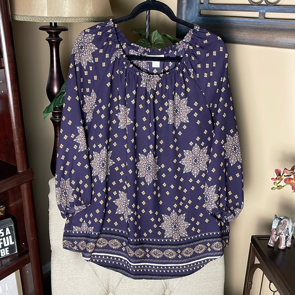 Loose fitting comfortable yet put together top.